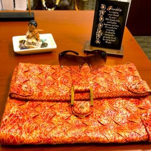 Woven orange clutch